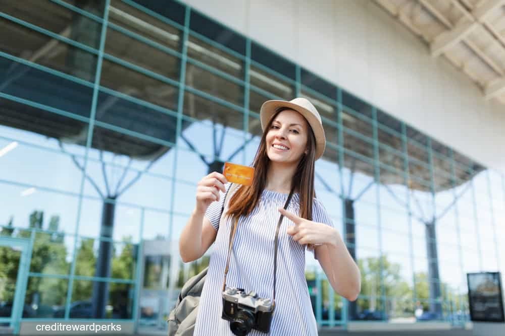 woman with credit card and camera